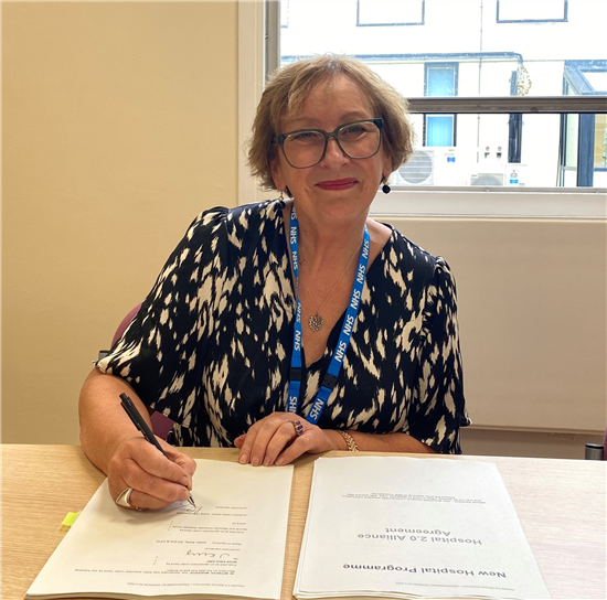 Prof Dwyer signing the agreement